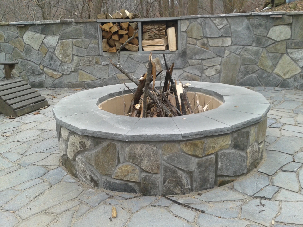 Custom outdoor fire feature installation by Timberstone Landscape in Suwanee, GA