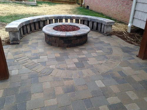 Fire feature with integrated patio design in Northeast Atlanta by Timberstone