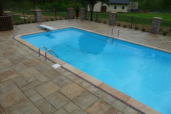 Custom pool deck installation in Forsyth County Georgia by Timberstone Landscape
