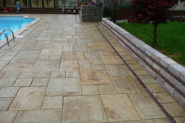 Travertine pool deck renovation in Georgia by Timberstone Landscape
