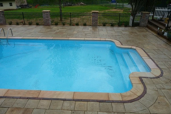Custom pool deck with integrated landscape in Forsyth County Georgia