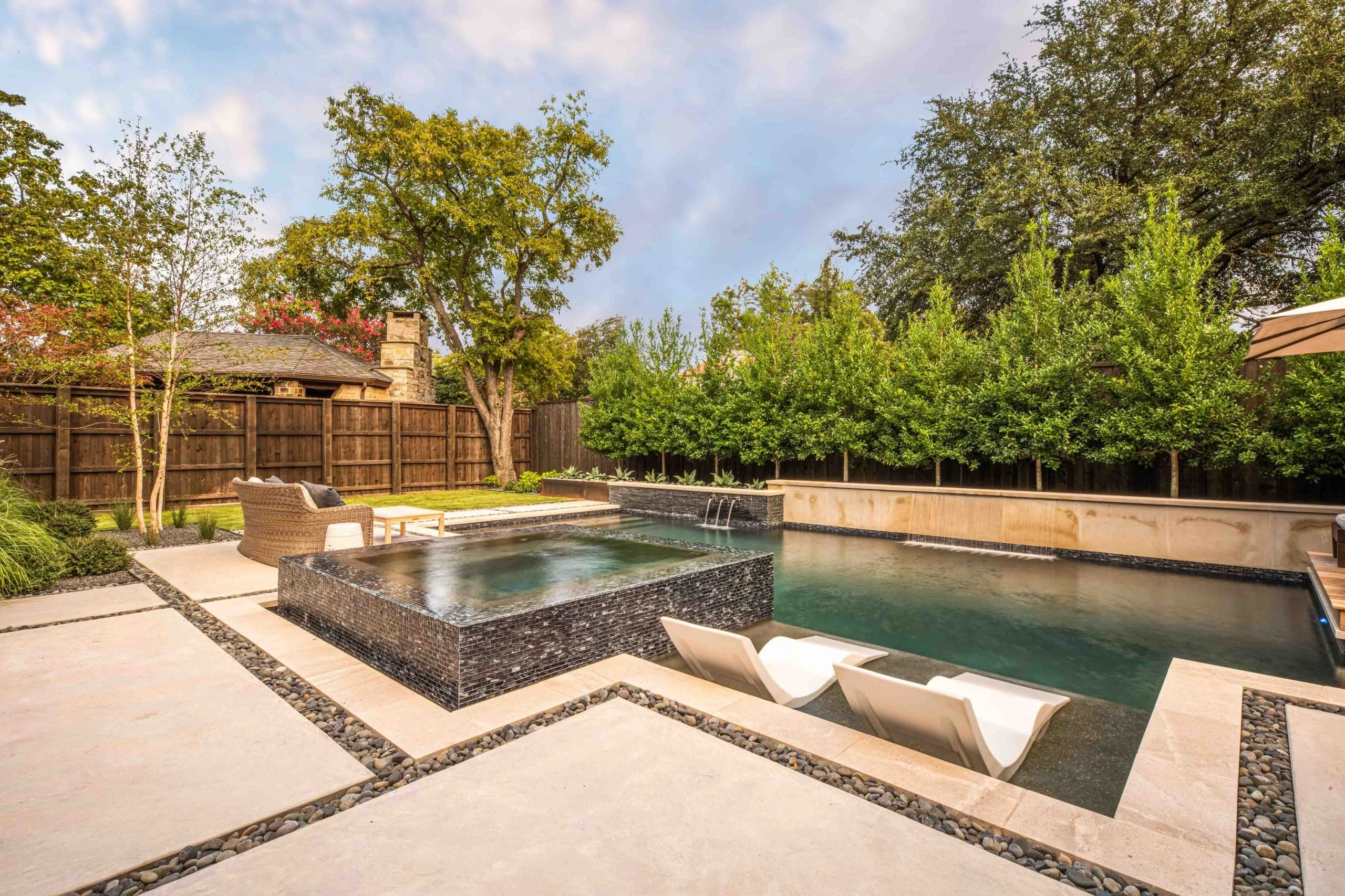 Completed travertine pool deck project by Timberstone Landscape