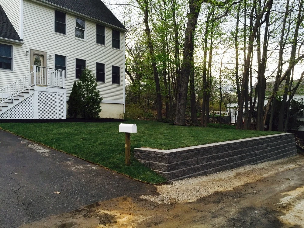 Why Snellville, GA Properties With Grading Problems Need a Retaining Wall That Solves Drainage Too